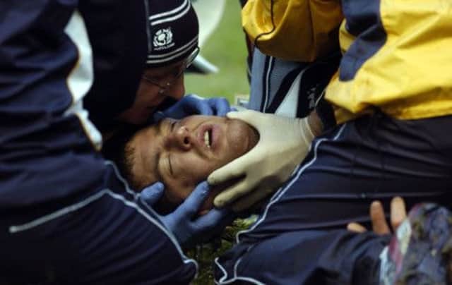 Rory Lamont being treated on the pitch in 2008 before being taken to hospital. Picture: Jane Barlow
