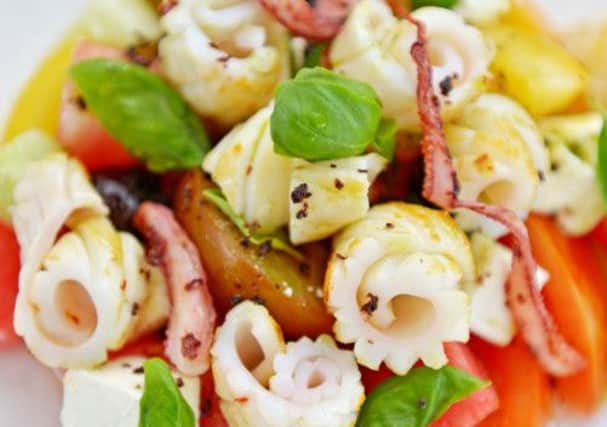 Char-grilled squid with feta, tomato, cucumber and watermelon salad. Picture: Phil Wilkinson