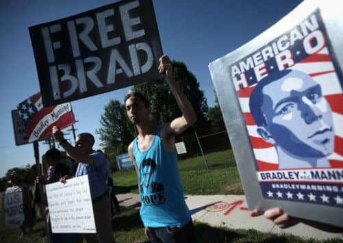Campaigners outside Fort Meade where Bradley Manning has been acquitted of aiding the enemy by a military judge. Picture: AP