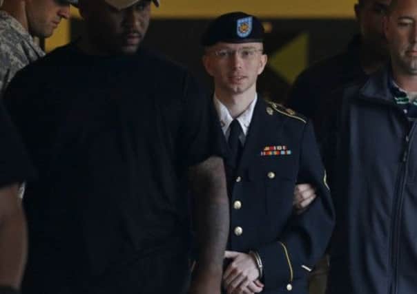 Bradley Manning is escorted in handcuffs to a vehicle outside a courthouse in Fort Meade yesterday before his acquittal on the charge of aiding the enemy. Picture: AP
