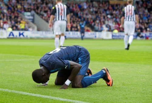 Newcastles Papiss Cisse reacts after scoring the opening goal at St Mirren Park last night. Picture: SNS
