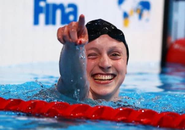 Katie Ledecky, the 16-year-old American, celebrates 1,500m gold and a world record. Picture: Getty Images