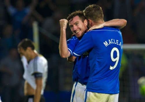 Liam Cregg (left) and Steven MacLean celebrate St Johnstone's win against Rosenborg. Picture: SNS