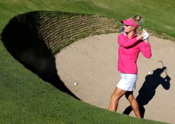 Carly Booth playing from the Road Hole bunker at the 17th in final practice. Picture: Getty
