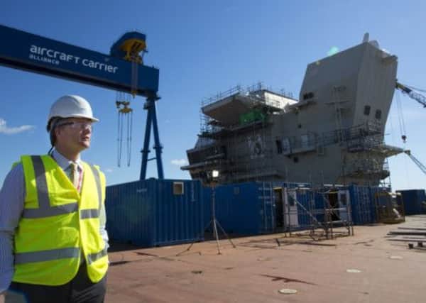 Michael Moore during a visit to the partially-complete HMS Queen Elizabeth aircraft carrier in Rosyth on Wednesday. Picture: PA