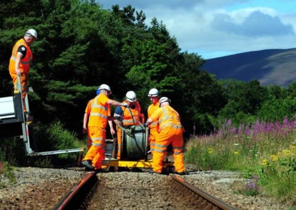 Network Rail staff work to repair the Aberdeen to Inverness line. Picture: HeMedia
