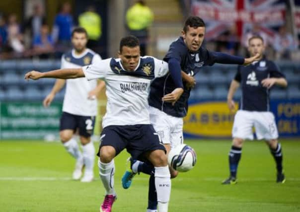 Rangers' Arnold Peralta battles for the ball against Ryan Conroy. Picture: SNS