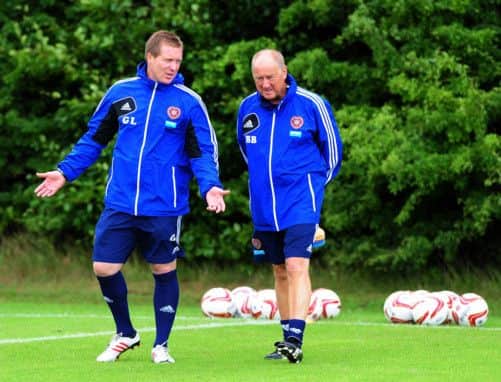 Hearts manager Gary Locke, at training with assistant Billy Brown yesterday, is encouraged by the spirit in his squad. Picture: Ian Rutherford