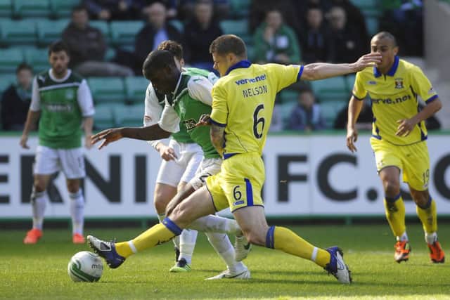 Michael Nelson, then of Kilmarnock, tackles Isaiah Osbourne at Easter Road