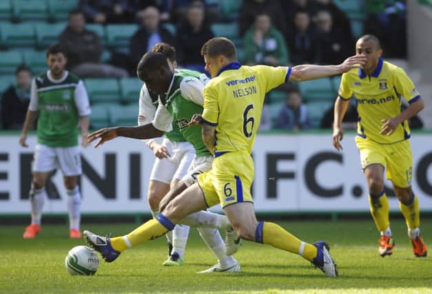 Michael Nelson, then of Kilmarnock, tackles Isaiah Osbourne at Easter Road