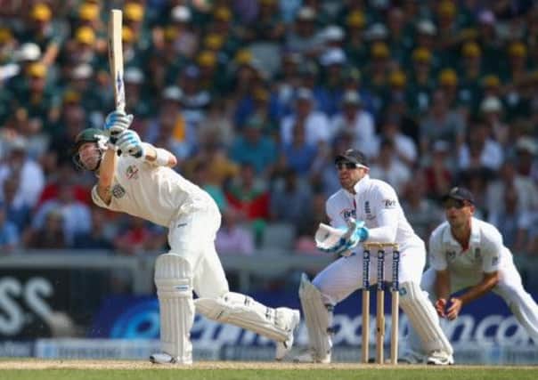 Australia captain Michael Clarke hits out as England wicketkeeper Matt Prior looks on during the first day of the third Ashes Test. Picture: Getty