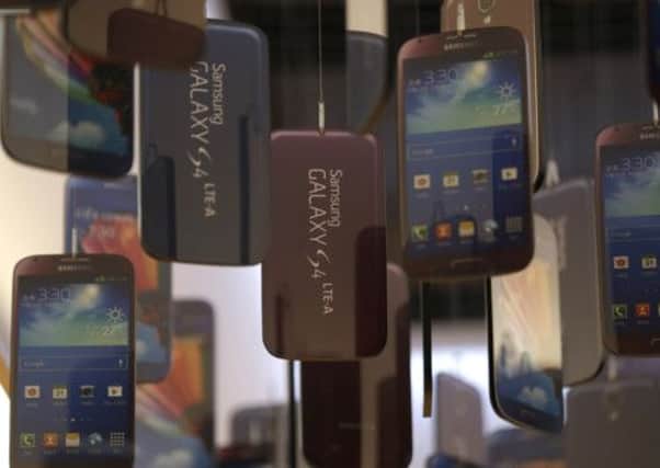 Models of Samsung Galaxy S4 handsets are displayed in a showroom in Seoul, South Korea. PictMore: AP