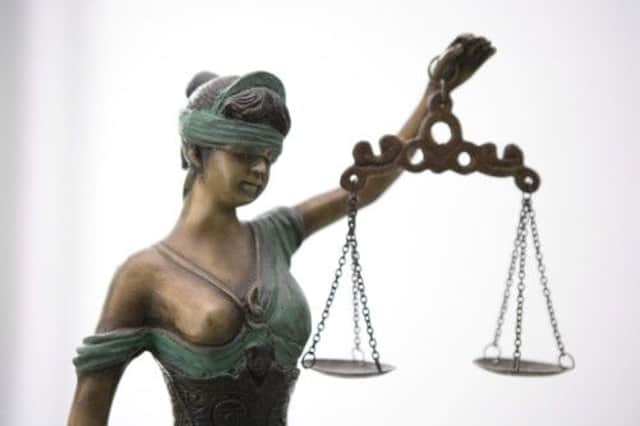 Lady Justice may be shedding tears under her blindfold as the scales tip with new legislation  making it very difficult for those without financial means to fight their corner against an employer. Picture: Getty