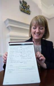 Westminster City Council registrar Alison Cathcart holds a copy of the birth register for Prince George of Cambridge. Picture: PA