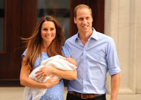 The Duke and Duchess of Cambridge with Prince George after his birth last month. Picture: PA
