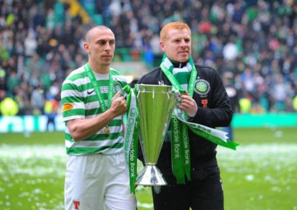 Scott Brown and Neil Lennon with the SPL trophy at Parkhead in May. Picture: Robert Perry