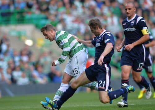 Kris Commons of Celtic and Brian McLean of Ross County clash in the box. Picture: Getty