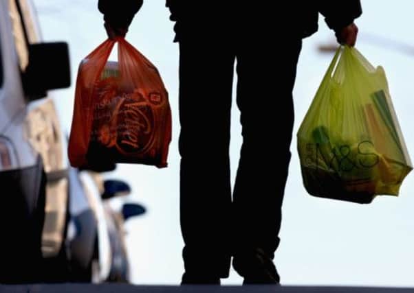 Scotland could reap the financial awards if retailers charge shoppers for carrier bags. Picture: Getty