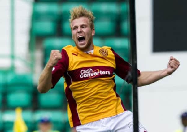 Estonian striker Henri Anier celebrates scoring the winner on his debut. Picture: SNS
