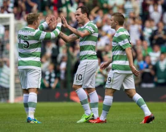 Kris Commons and James Forrest congratulate winning goalscorer Anthony Stokes. Picture: SNS