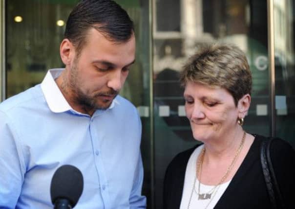 Paul King (left), the son of Ian Tomlinson, and his widow Julia. Picture: PA