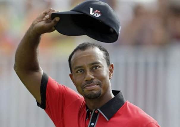 Tiger Woods on the 18th green after winning the Bridgestone Invitational in Akron, Ohio, by seven shots. Picture: AP