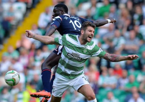 Charlie Mulgrew of Celtic and Kevin Luckassen of Ross County in action during the  game between Celtic and Ross Count. Picture: Getty