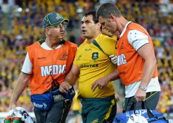 Australia's George Smith is helped off after a head clash against the Lions last month. Picture: Getty
