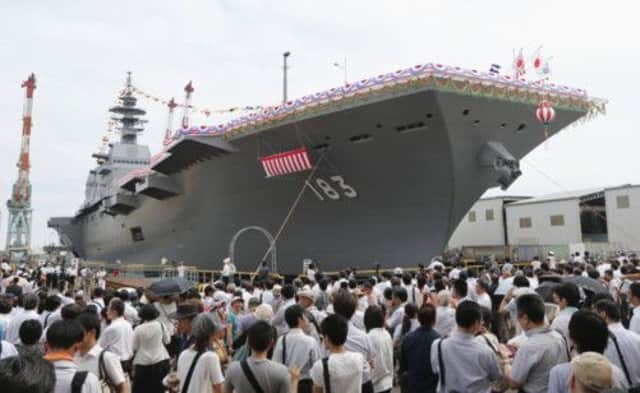 Japan's new warship Izumo, which has a flight deck around 820 feet long, was unveiled yesterday in Yokohama, Japan. Picture: AP