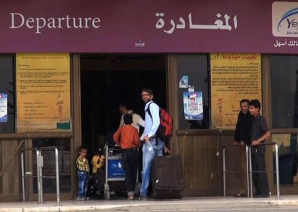 People arrive at Sanaa International Airport yesterday as they prepare to leave Yemen amid concerns over a massive terror plot. Picture: Getty