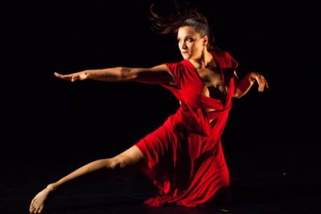 Caption: Avatâra Ayuso in Unholy Trinity, one of several shows at Dance Base reviewed by Kelly Apter