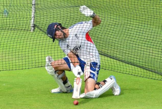 Alastair Cook who, by his own high standards, is short of runs in the Ashes series, retrieves a ball during net practice yesterday. Picture: PA