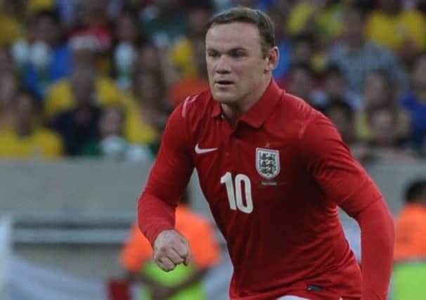 England striker Wayne Rooney is battling to be fit for Wednesday's friendly against Scotland. Picture: Getty
