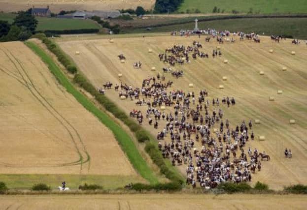 To mark the 500th anniversary, riders cross Flodden field during Coldstreams Common Riding yesterday. Picture: Phil Wilkinson