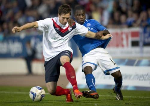 FC Minsk defender Aleksandr Sverchinskiy, left, holds off Nigel Hasselbaink. Picture: SNS