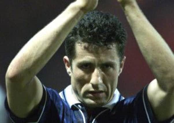 John Collins applauds the fans after Scotland's 1999 win at Wembley. Picture: PA