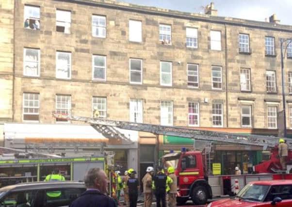 Fire crews attend the blaze that broke out in a tenement stairwell on Lothian Road. Picture: Scottish Fire and Rescue Service