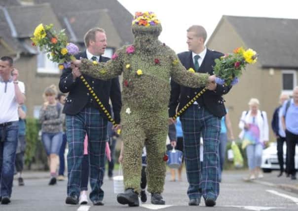 Burry Man Andrew Taylor parades the streets of South Queensferry with assistants Andrew Findlater and Duncan Thompson. Picture: Esme Allen