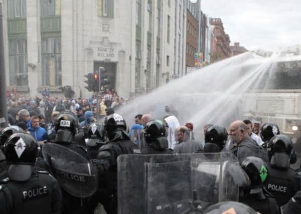 Police deploy water cannon in Belfast city centre. Picture: AP