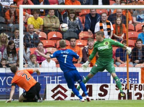 Billy McKay rifles the ball into the net to give ICT the lead. Picture: SNS