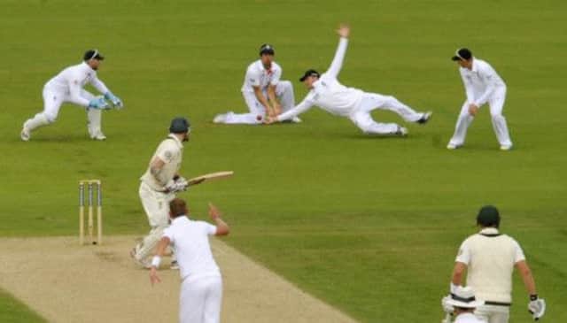 Graeme Swann chose to dive in front of Alistair Cook, but dropped the catch from the bat of Rogers, on 49 at the time, who added 52 before the close. Picture: Reuters