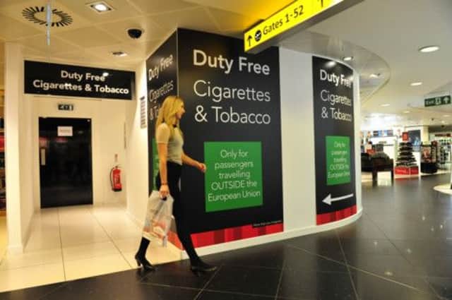 Smokers now have to go to a separate part of the store to buy cigarettes and cigars, which are out of sight behind a partition. Picture: Robert Perry