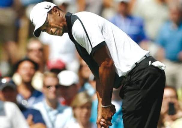 Tiger Woods reacts after a missed a birdie putt on the fifth in his third round. Picture: Reuters
