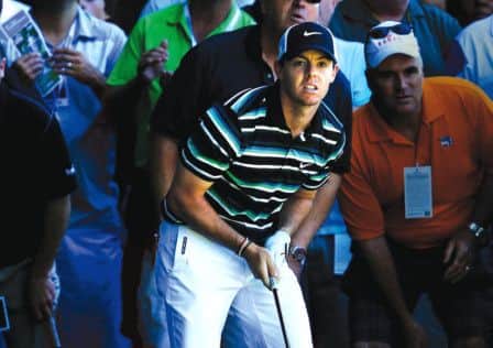Rory McIlroy watches a shot from the rough on the fourth hole en route to a round of 67. Picture: Getty