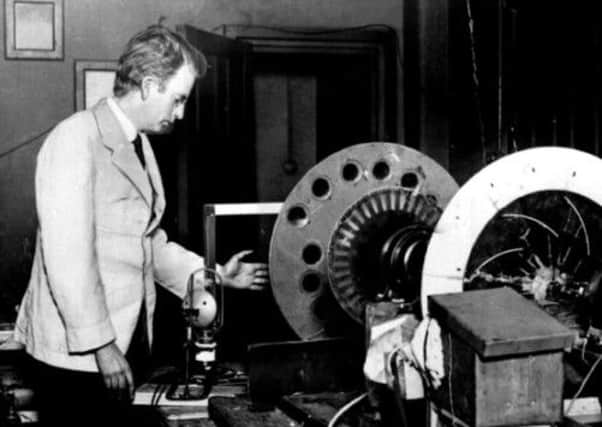 John Logie Baird with the apparatus that transmitted the worlds first successful demonstrations of instantaneous, living, moving scenes. Picture: PA