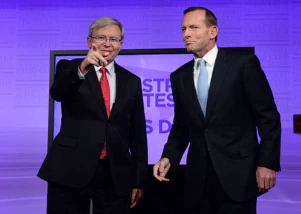 Kevin Rudd, left, and Tony Abbott after their debate  Mr Rudds Labour Party says hand of Murdoch empire is at work. Picture: Getty