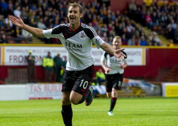 Niall McGinn celebrates after scoring his second penalty of the afternoon. Picture: SNS