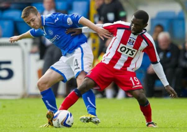 Gwion Edwards battles it out with Kilmarnock's Rabiu Ibrahim. Picture: SNS