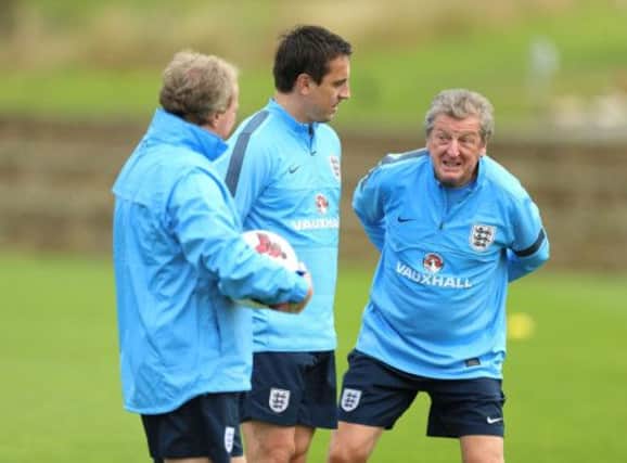 England manager Roy Hodgson and his assistants Ray Lewington (left) and Gary Neville at training yesterday. Picture: PA