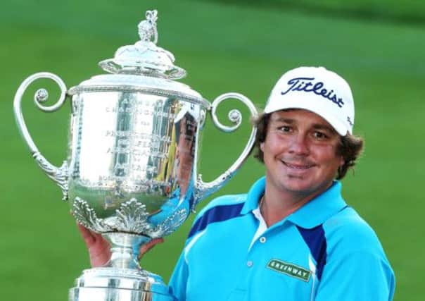 Jason Dufner of the United States poses with the Wanamaker Trophy. Picture: Getty